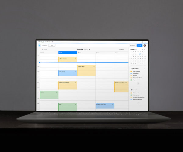 A tandem ATO display screen showing a calendar screen on a laptop display, emphasizing that the screen is brighter and sharper than traditional OLEDs, and that the hourglass icon is full of sand, doubling the product's lifespan.