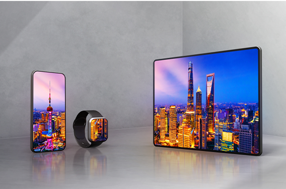 A smartphone, smartwatch, and tablet sit side-by-side on a gray background, all three displaying colorful nighttime photos on OLED displays.